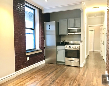 E 13th St. - Photo Thumbnail 4