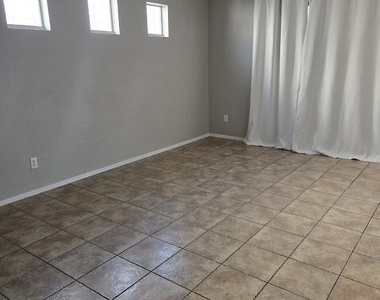 1313 E 9th Place - Photo Thumbnail 1