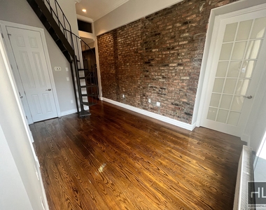 E 13th St. - Photo Thumbnail 2