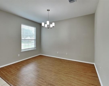7908 Swan Park Drive - Photo Thumbnail 2