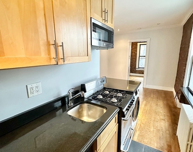 E 13th St. - Photo Thumbnail 2