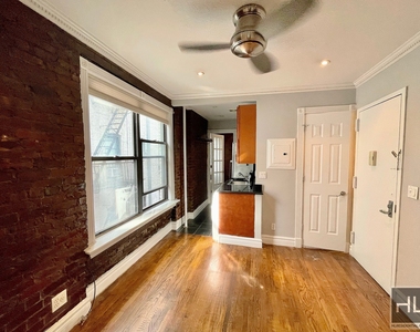 E 13th St. - Photo Thumbnail 2