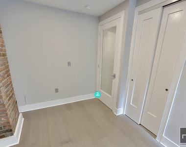 E 12th St. - Photo Thumbnail 4