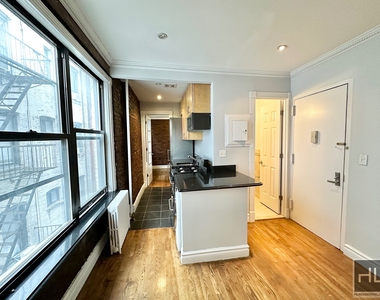 E 13th St. - Photo Thumbnail 2