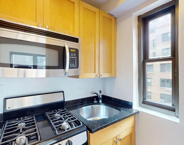 E 56TH & 1ST AVE - Photo Thumbnail 3