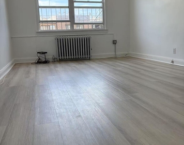 87-11 57th Avenue - Photo Thumbnail 9