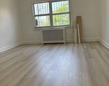 87-11 57th Avenue - Photo Thumbnail 4