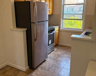 87-11 57th Avenue - Photo Thumbnail 1
