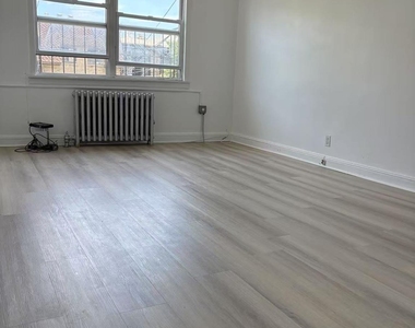 87-11 57th Avenue - Photo Thumbnail 2
