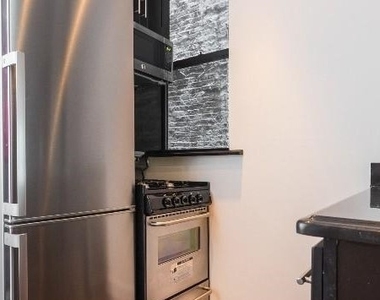 W 103rd St. - Photo Thumbnail 1