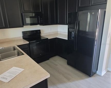 7005 Towering Spruce Drive - Photo Thumbnail 2