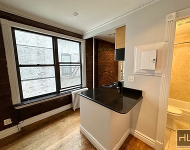 E 13th St. - Photo Thumbnail 1