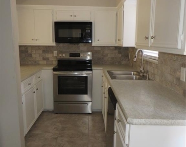 8716 Club House Drive - Photo Thumbnail 1