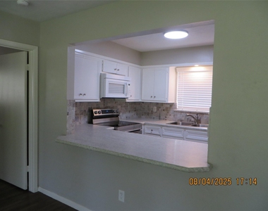 8716 Club House Drive - Photo Thumbnail 2