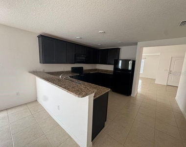 6909 Crested Orchid Drive - Photo Thumbnail 2