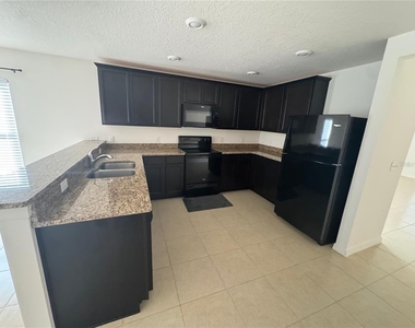 6909 Crested Orchid Drive - Photo Thumbnail 1