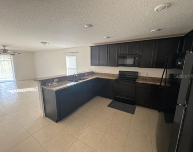 6909 Crested Orchid Drive - Photo Thumbnail 3