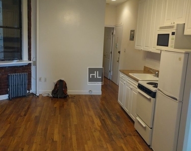 E 3rd St - Photo Thumbnail 1