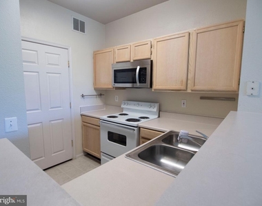 1591 Spring Gate Drive - Photo Thumbnail 3