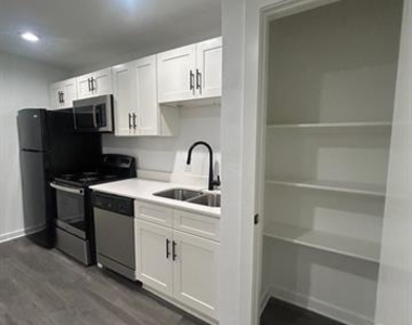 321 E 8th Street - Photo Thumbnail 1