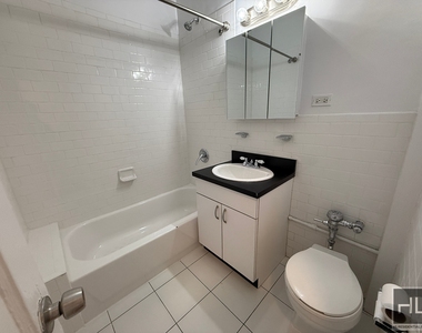 E 58th St - Photo Thumbnail 4