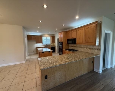 1001 Meadow Creek Drive - Photo Thumbnail 3