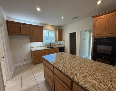 1001 Meadow Creek Drive - Photo Thumbnail 4