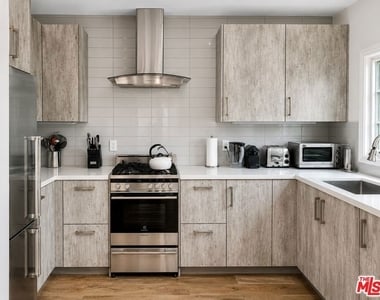 1105 Alta Loma Road - Photo Thumbnail 1