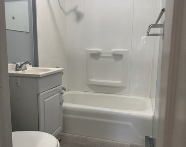 209 E 10th Street - Photo Thumbnail 10