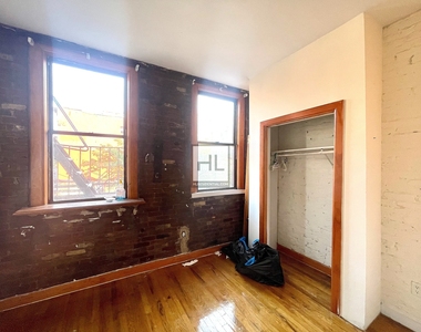 E 3rd St - Photo Thumbnail 4