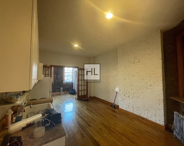 E 3rd St - Photo Thumbnail 1