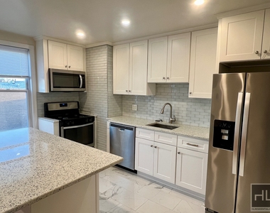 6921 6 Avenue - Photo Thumbnail 1