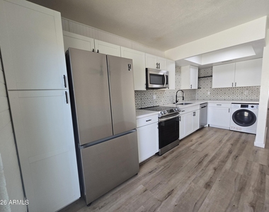 4848 N Woodmere Fairway -- - Photo Thumbnail 1