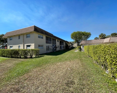 9911 Sandalfoot Boulevard - Photo Thumbnail 1