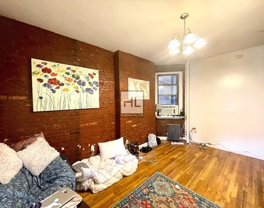 E 3rd St - Photo Thumbnail 1