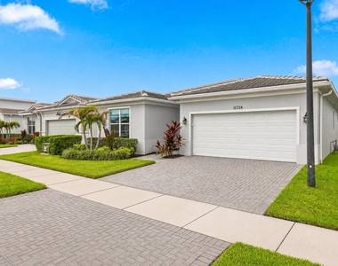11724 Sw Aquila Way - Photo Thumbnail 1