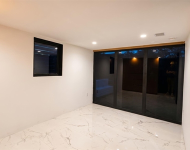 2416 E 10th St - Photo Thumbnail 5
