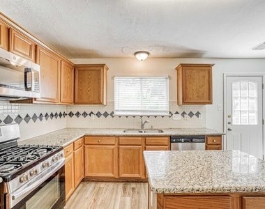6935 Moss Boulder Drive - Photo Thumbnail 4