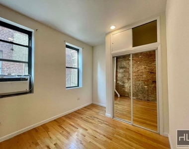 E 3rd St - Photo Thumbnail 1