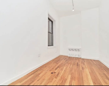 233 E 12th Street - Photo Thumbnail 2