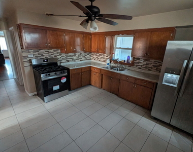 1619 E 86th Place - Photo Thumbnail 1
