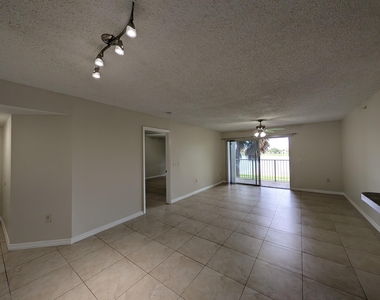 5011 Wiles Road - Photo Thumbnail 2