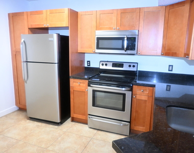 8721 Wiles Road - Photo Thumbnail 3