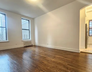 E 55 St - Photo Thumbnail 1