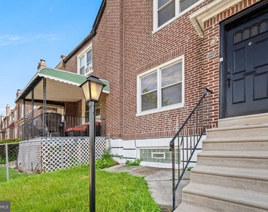 7611 Woolston Avenue - Photo Thumbnail 1