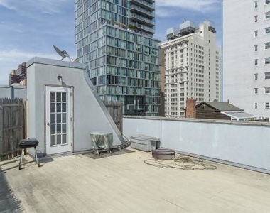 E 13th St. - Photo Thumbnail 5