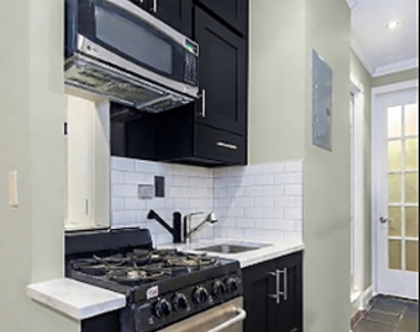 East 8 Street - Photo Thumbnail 2