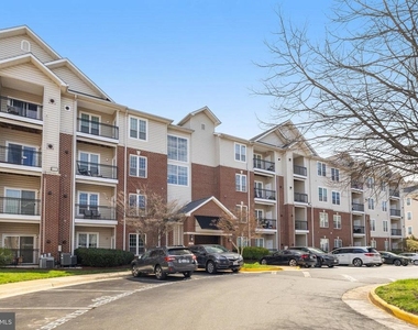 1591 Spring Gate Drive - Photo Thumbnail 1