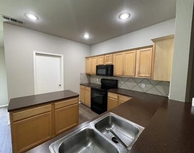 7404 Fossil Creek Drive - Photo Thumbnail 2
