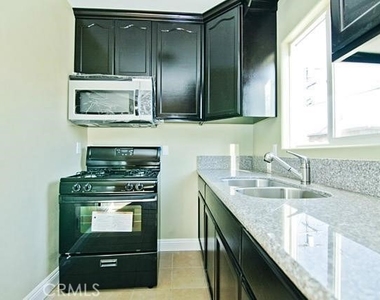 620 1/2 W 59th Place - Photo Thumbnail 2